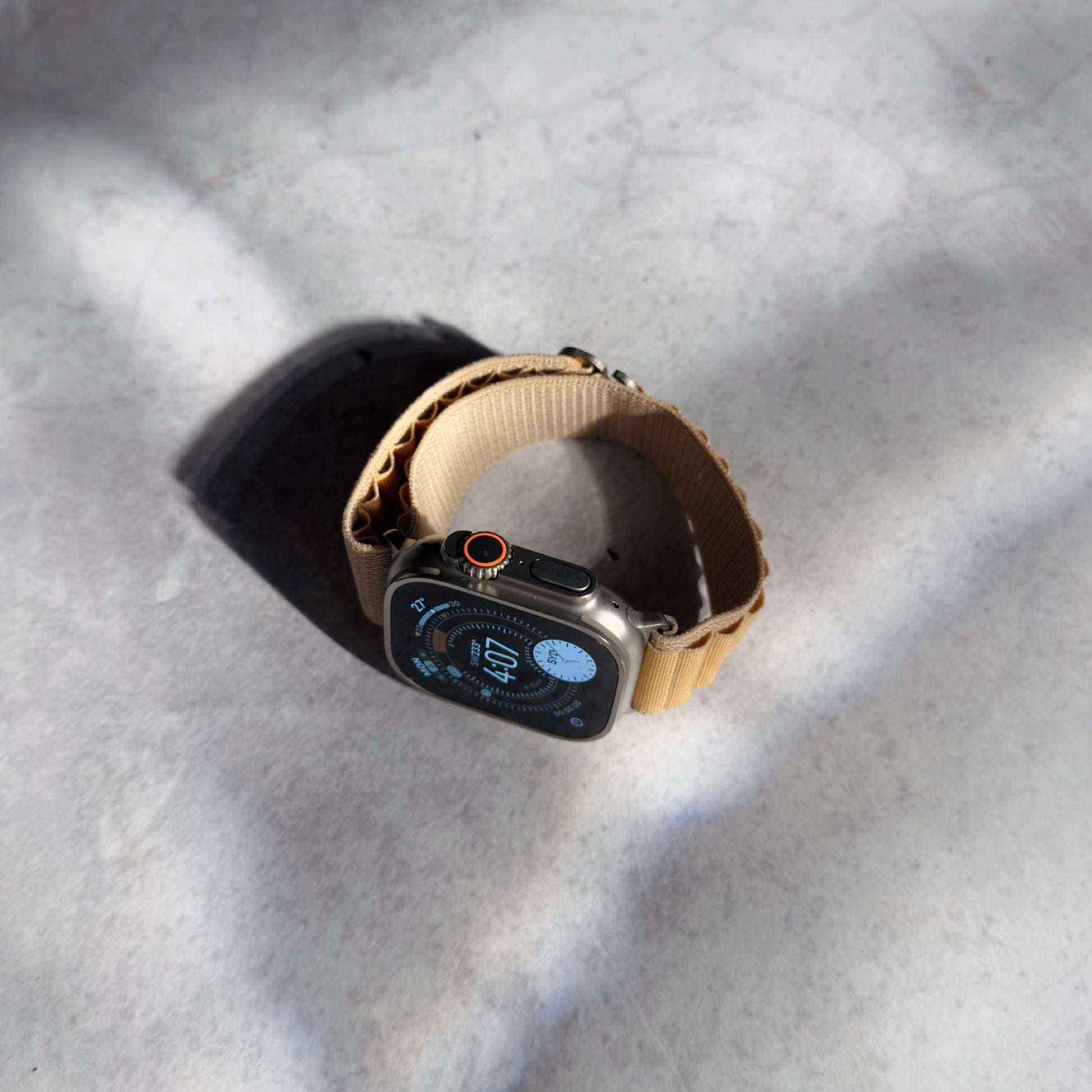 Apple Watch Ultra with tan Alpine Loop